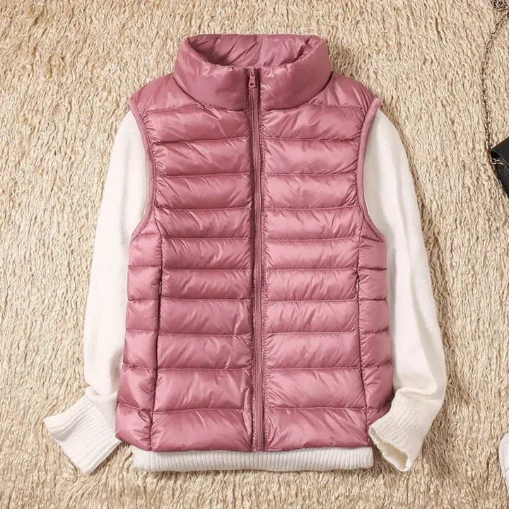 Trendy women's bodywarmer vest with zipper closure, excellent for chic layering in fall/spring.
