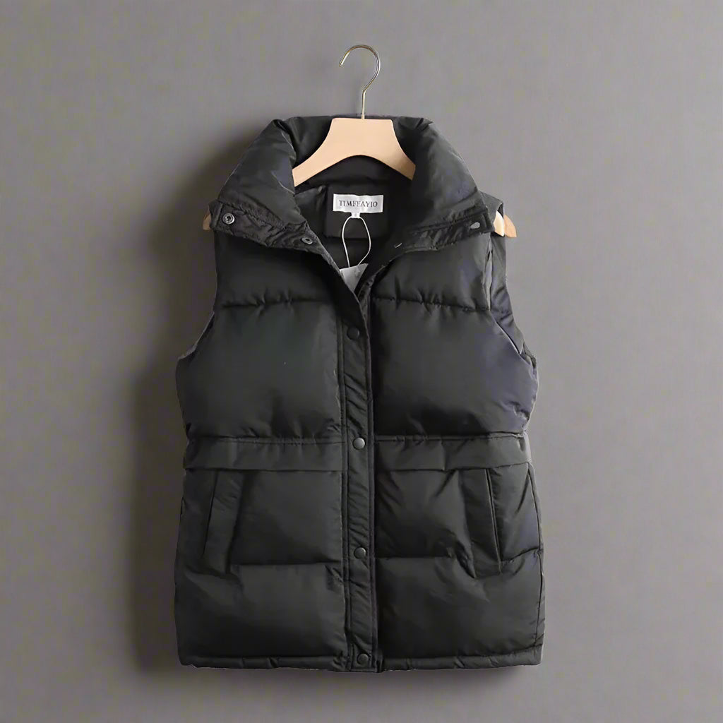 Women's windproof bodywarmer, sleek thermal vest for cozy fall & winter layering. Ideal casual outerwear.