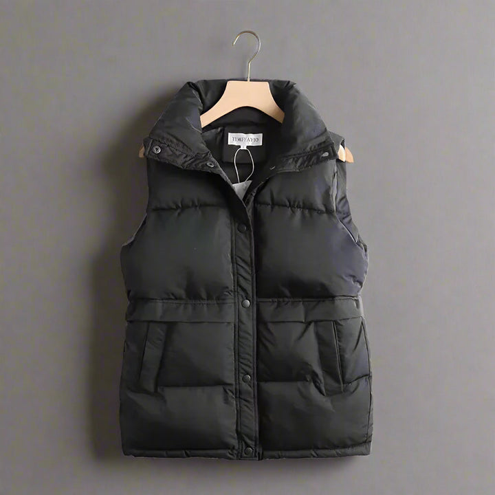Women's windproof bodywarmer, sleek thermal vest for cozy fall & winter layering. Ideal casual outerwear.