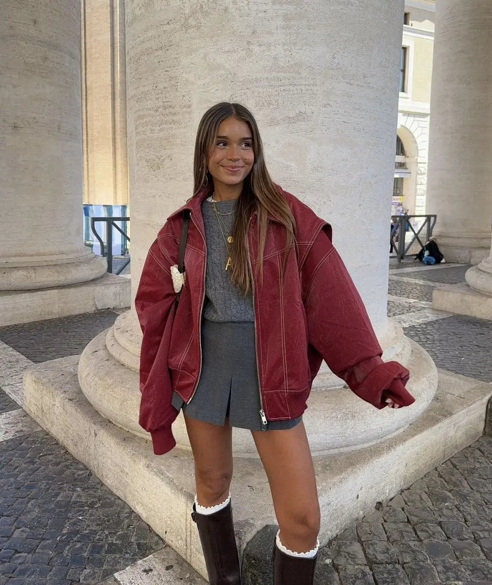 Women's wine red oversized quilted jacket with stylish contrast stitching. Ideal fall fashion outerwear.