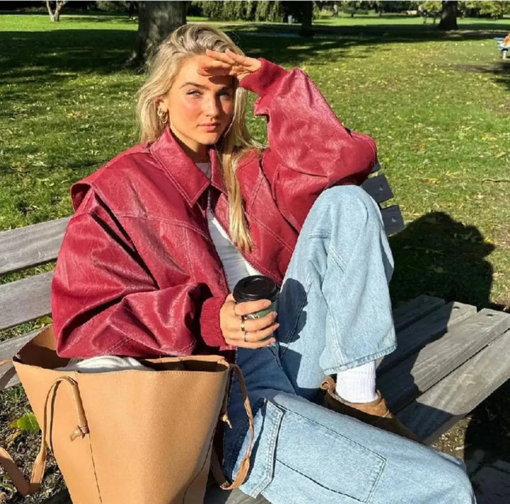 Versatile women's wine red oversized quilted jacket, ideal for layering. Features contrast stitch & zip-up.