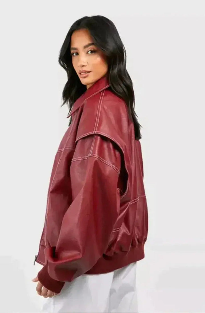 Stylish women's wine red oversized bomber jacket, quilted with distinct contrast stitching. Fall fashion essential.
