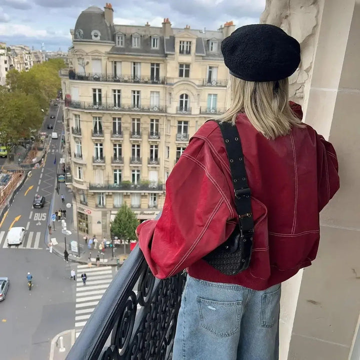 Women's wine red oversized zip-up quilted jacket, featuring trendy contrast stitching for a modern look.