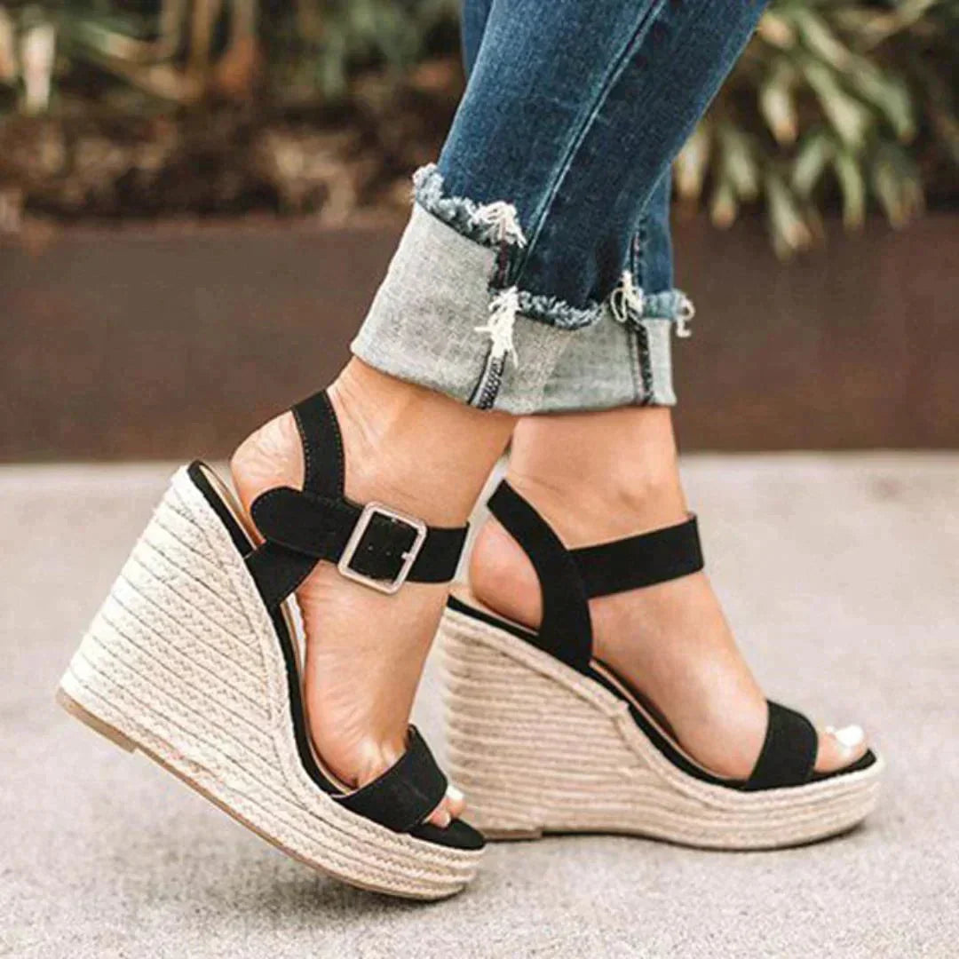 Casual women's open-toe sandals featuring a stylish woven wedge heel & secure ankle strap, perfect for summer.