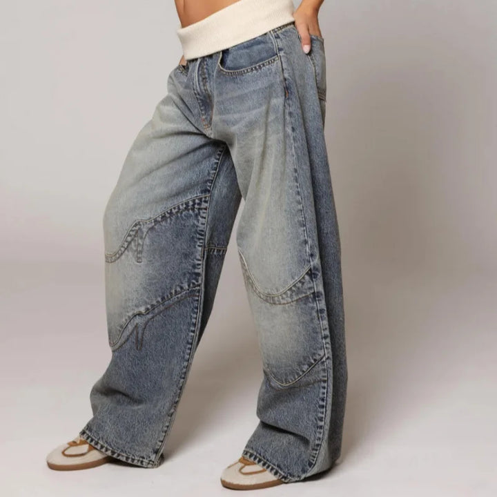 Oversized women's Y2K wide leg denim jeans with vintage wash and unique ribbed waist detail.