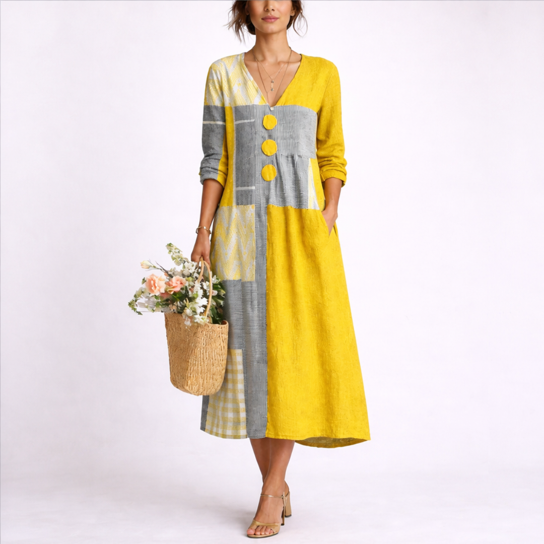 Women's yellow patchwork midi dress with a relaxed fit and button detailing. Perfect casual summer V-neck dress.