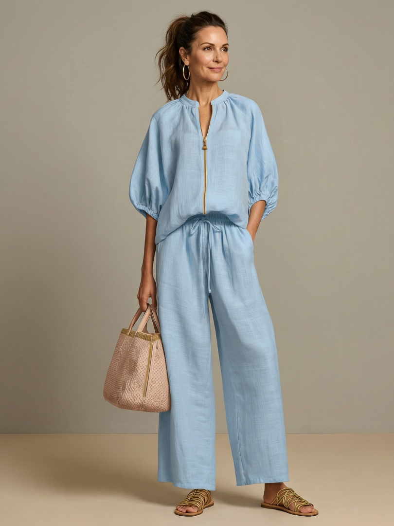Women's zip front blouson top and wide leg pants matching set. Casual summer outfit.