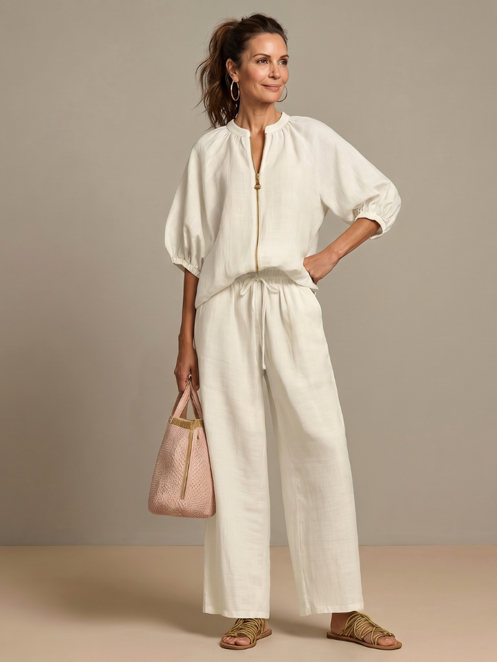 Elegant women's blouson top with a zip front paired with fashionable wide leg pants set.