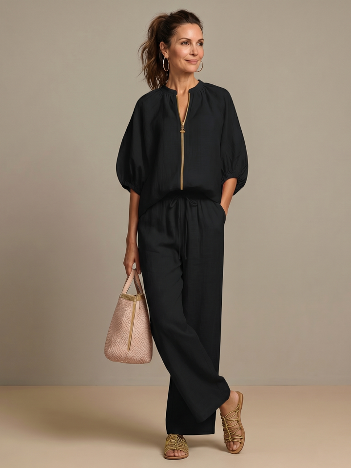Comfortable women's casual set: Blouson top with a front zip and relaxed wide leg pants.