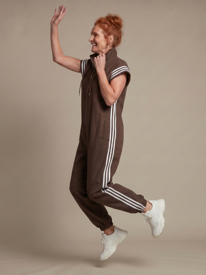 Versatile full-length women's stripe jumpsuit, designed with a front zip for easy wear & style.