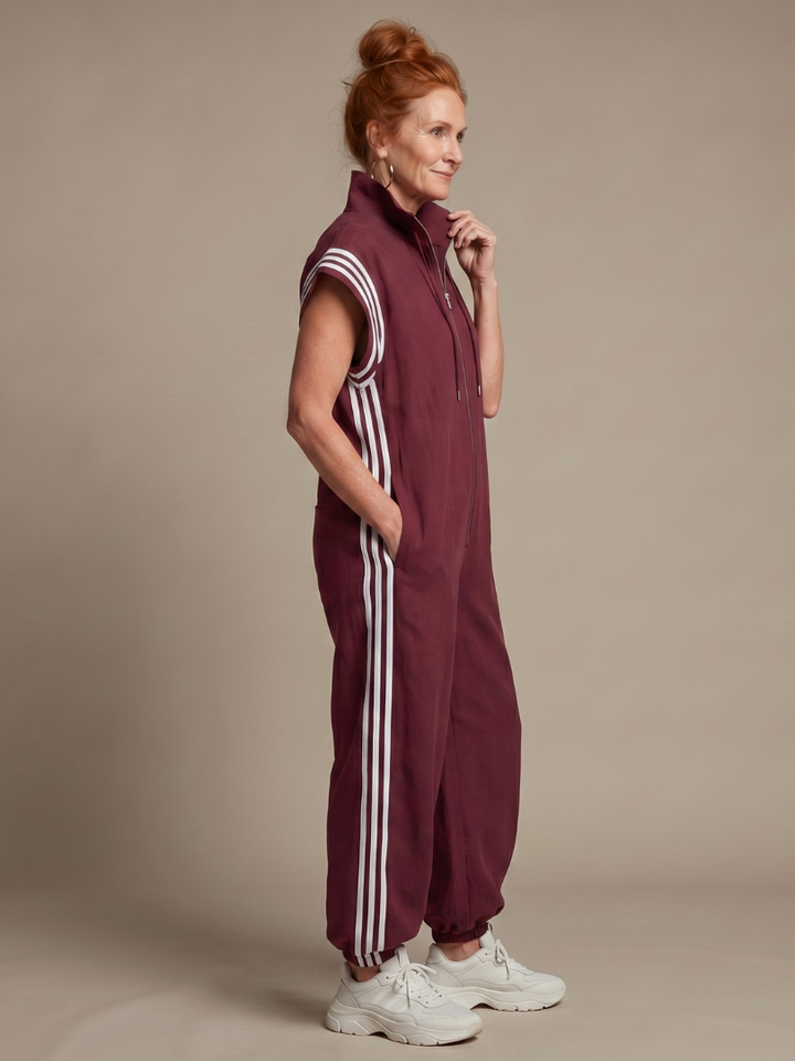 Full-length women's stripe jumpsuit featuring a stylish zip front and comfortable wide sleeves.