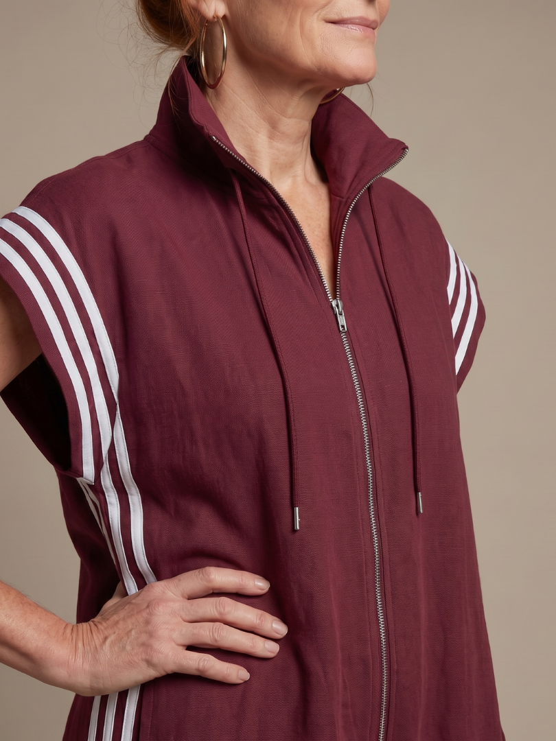 Modern women's one-piece jumpsuit with elegant stripe panels & a practical zip front closure.