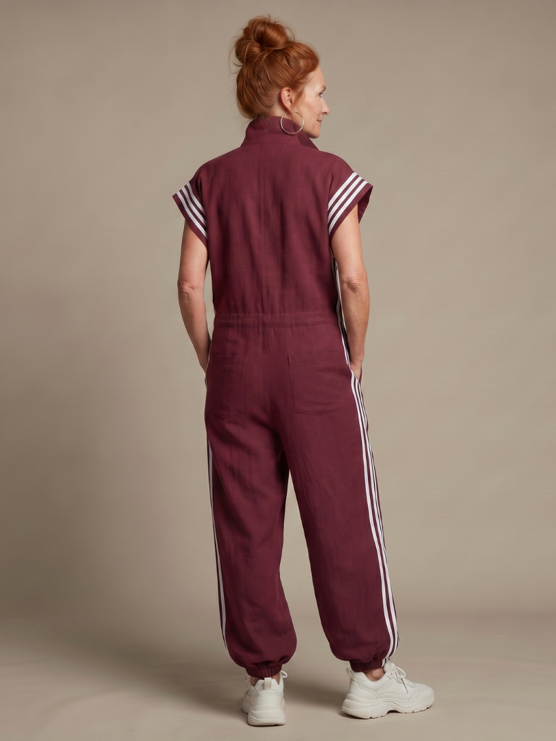Effortless style: women's relaxed fit jumpsuit with eye-catching stripe details & front zip.