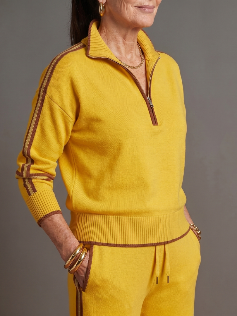 Fashionable women's co-ord set with a zip neck top, wide leg pants, and side stripe detail.