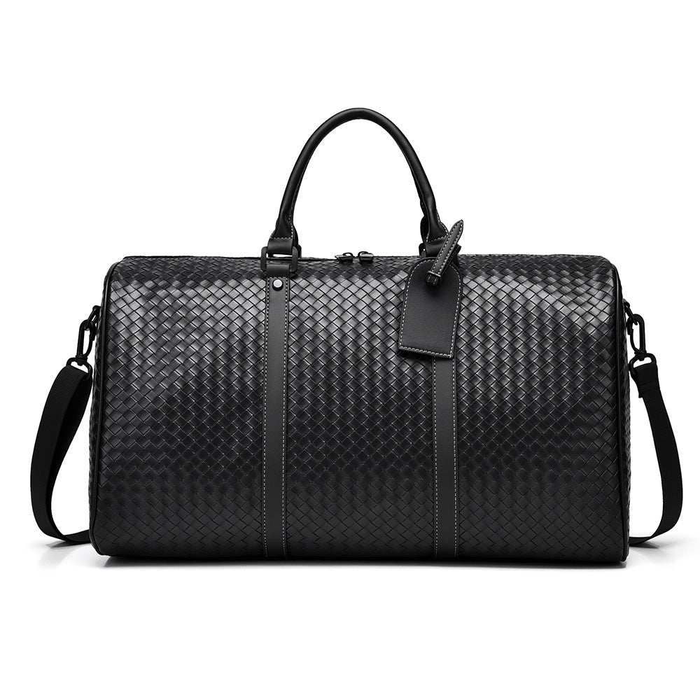 Woven leather unisex duffle bag for stylish weekend travel. Perfect carry-on.