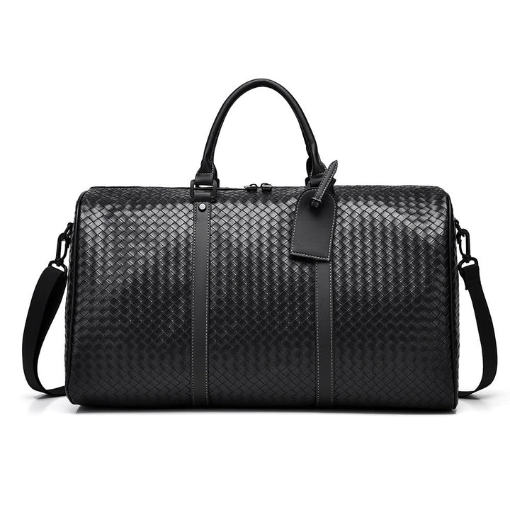 Woven leather unisex duffle bag for stylish weekend travel. Perfect carry-on.