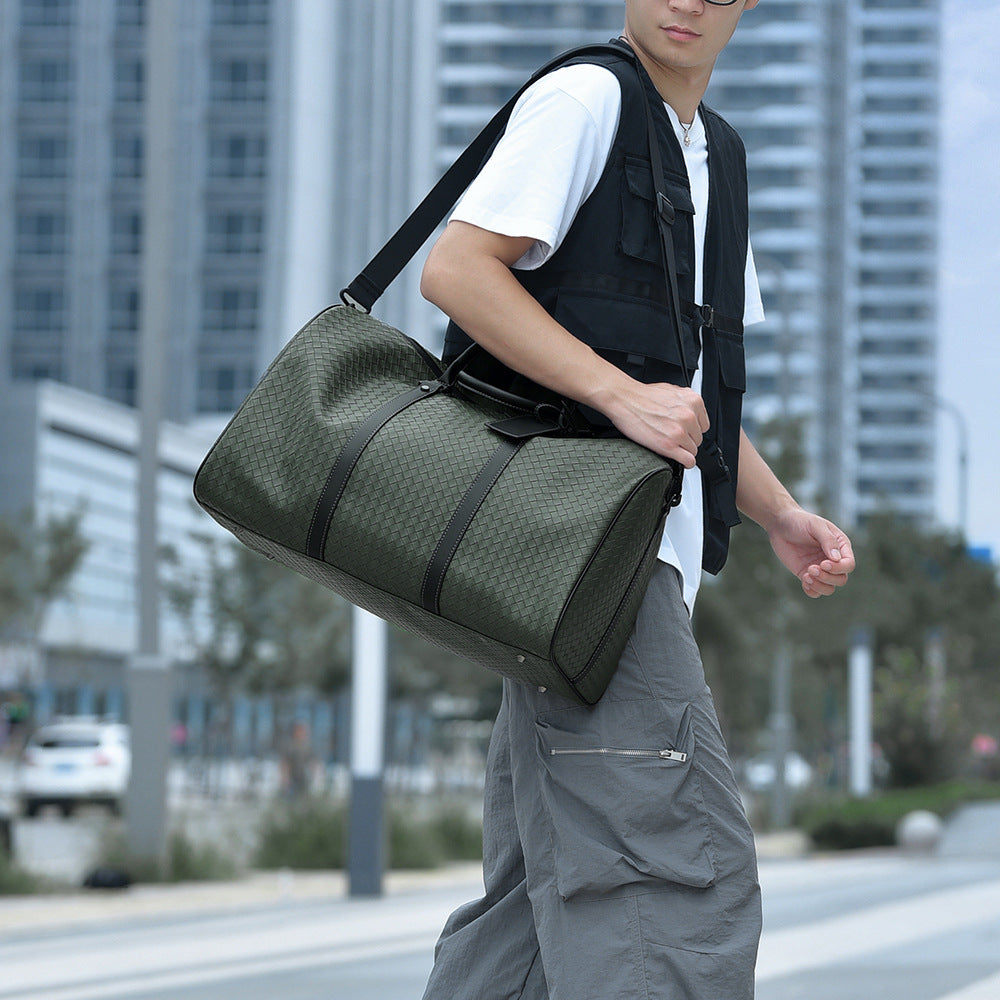Stylish unisex woven leather duffle bag for travel, gym, or short trips.
