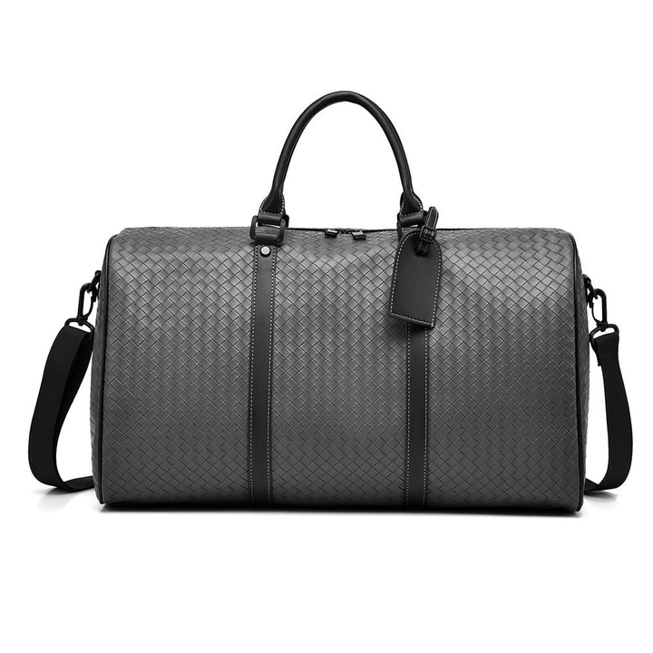 Compact woven leather carry-on duffle bag for modern unisex travel. Lightweight & stylish.