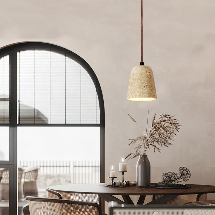 Rich walnut wood and yellow travertine pendant light, creating a modern, inviting dining atmosphere.