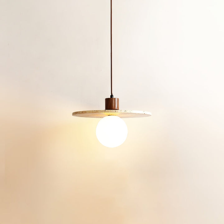 Elegant ambient lighting: yellow travertine & walnut pendant, a modern sculptural home accent.